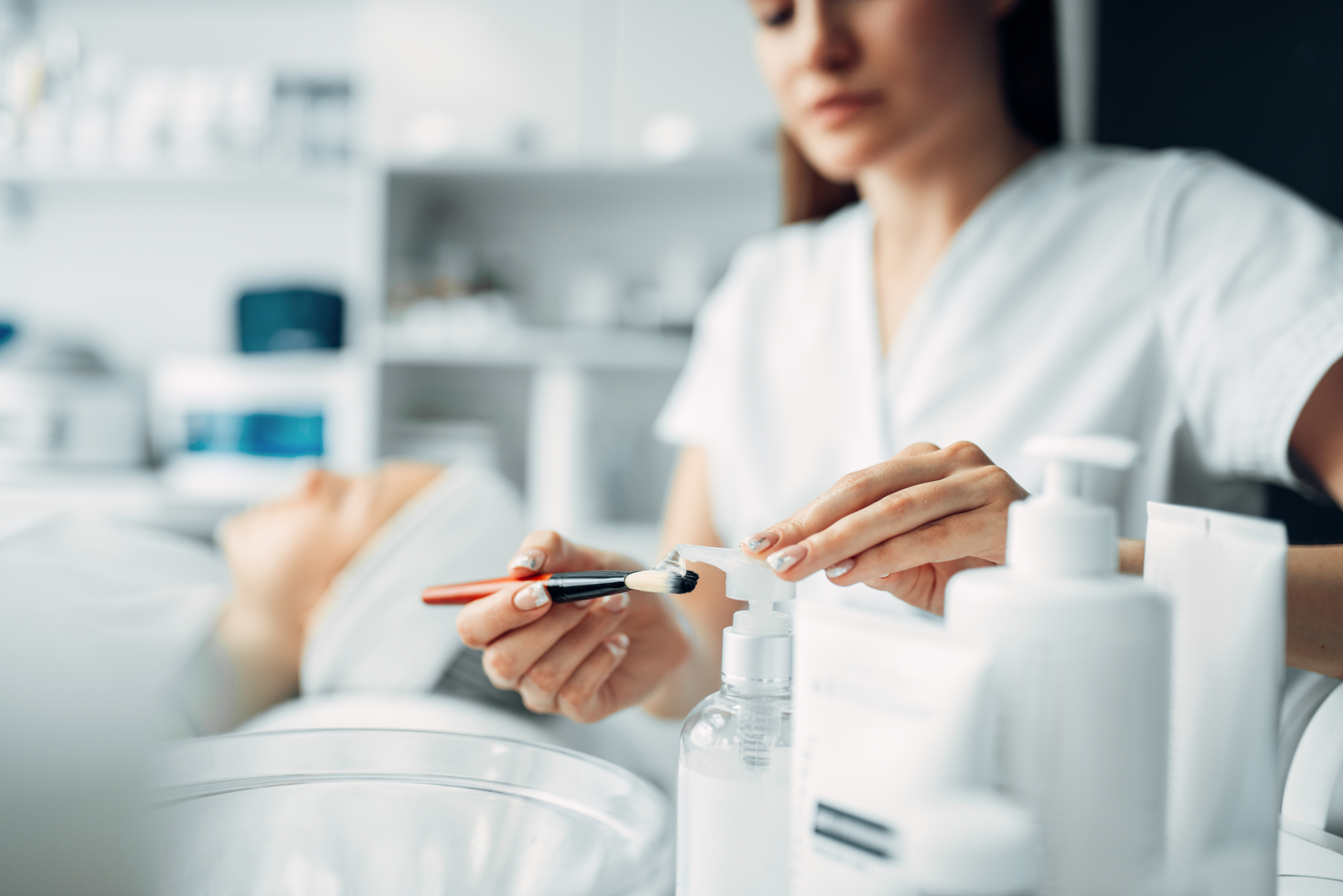 Beautician makes rejuvenation procedure to woman